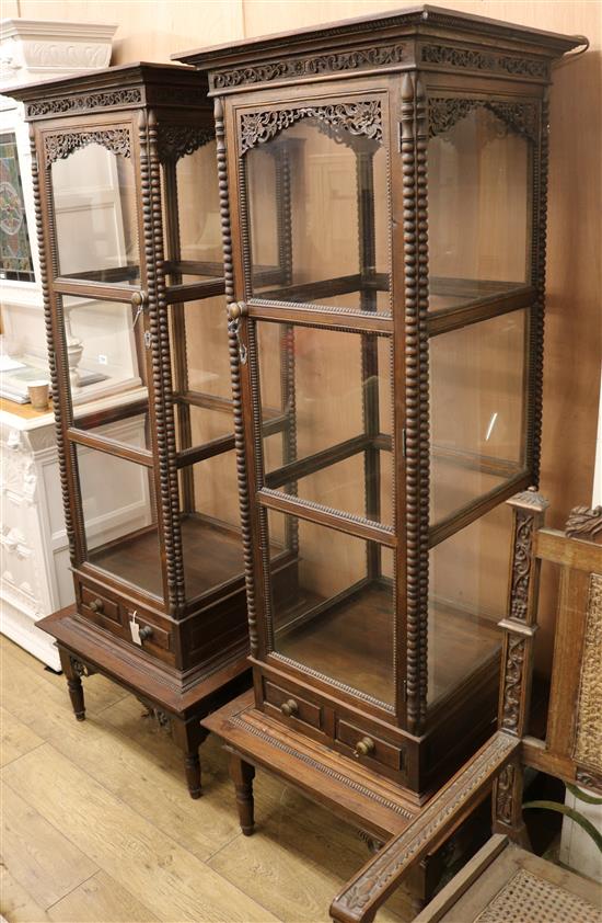 A pair of carved display cabinets W.70.5cm